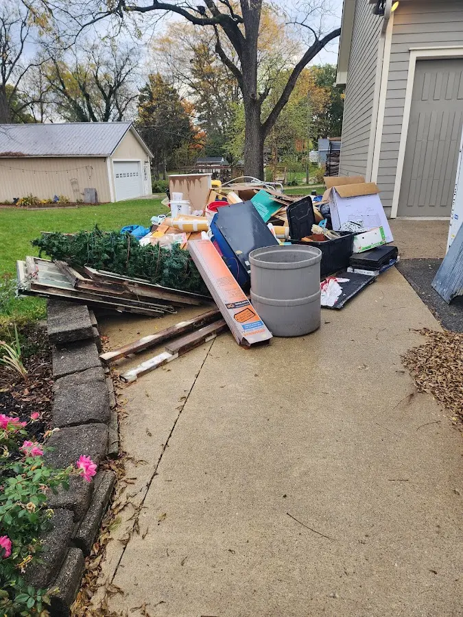 Dumpster being loaded with debris for 30 Yard Dumpster Rental in California